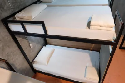Bunk Bed in Mixed Dormitory Room — White Jail at Koh Tao Hostel